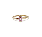 jayne moore jewelry dainty emerald cut sapphire cast not set with gold folding and flowing around the stone in a natural organic movement set in recycled gold refined gold handmade by model jayne moore writer made in nyc