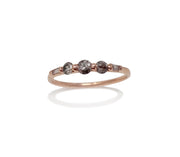 Incredibly beautiful grey diamond salt and pepper diamond brilliant cut five stone ring, featuring three extraordinary certified conflict free brilliant cut diamonds and two baguette diamonds set upside down #castnotset cast not set cast in place rebel set model jayne moore nyc jewelry designer jayne moore writer hand makes her own jewelry from recycled metals 