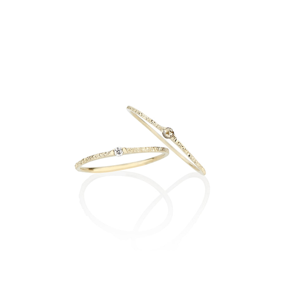 dainty delicate diamond stackable rings made by designer jayne moore in nyc using recycled gold and conflict free diamonds handmade by the model jayne moore writer 
