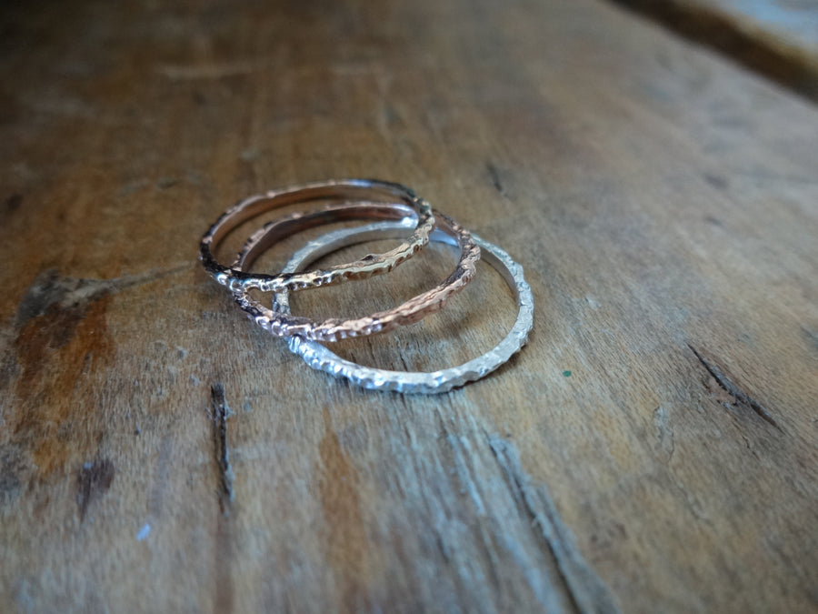 rainy dainty stacker rings dainty midi ring small elegant sparkly midi ring hand textured ring elegant rings made in nyc by Jayne Moore with recycled and refined golds 