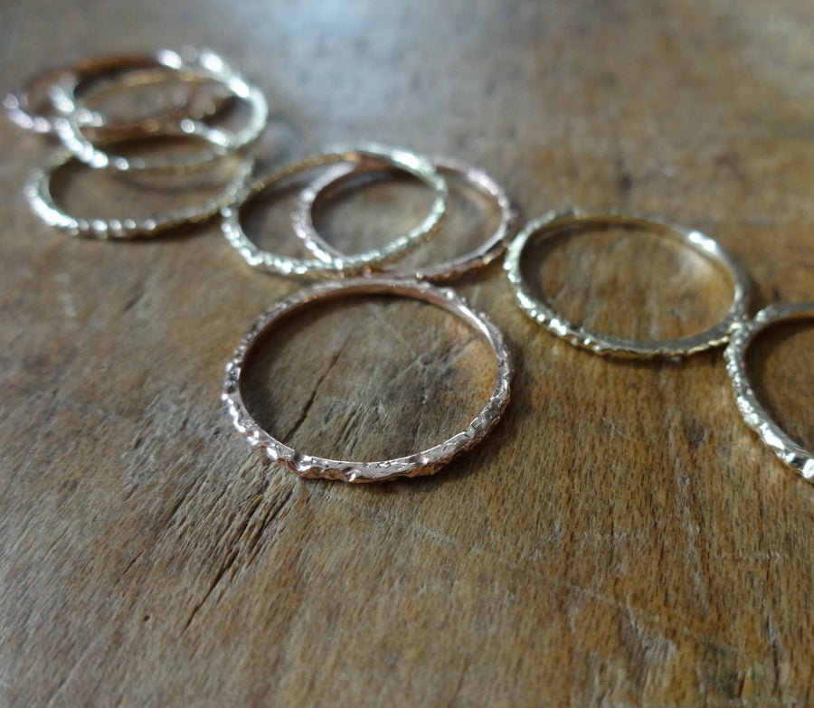 rainy dainty stacker rings dainty midi ring small elegant sparkly midi ring hand textured ring elegant rings made in nyc by Jayne Moore with recycled and refined gold 