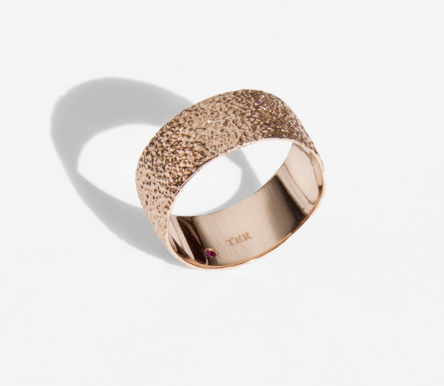 Simple elegant broad ring bands hand textured to emulate the dappled light naturally found in nature handmade in NYC by designer Jayne Moore model Jayne Moore from recycled refined metals in 18kt gold a light classic timeless wedding band for him or for her 
