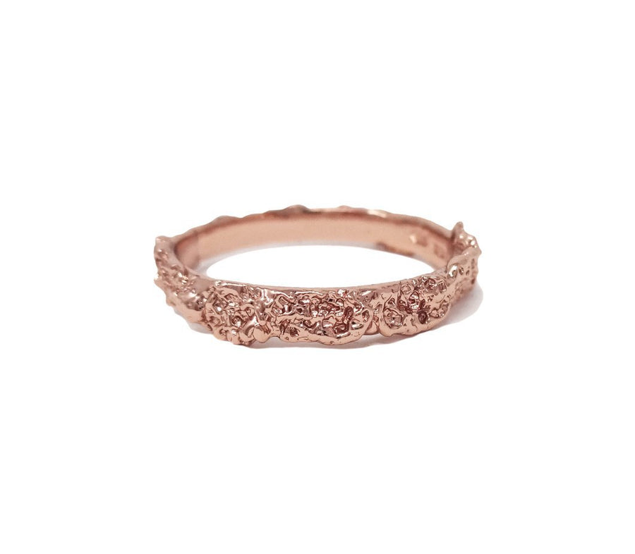 Model Jayne Moore makes handmade jewelry from her chelsea apartment in manhattan. This best selling stackable ring is made originally from cast sugar and salt. Created serendiptiously this raw texture is unique and sparkles with it natural texture. Cast here in Rose gold, it is an eye catching one of a kind ring, made from organic materials and recycled metal | made in NYC | sustainable jewelry